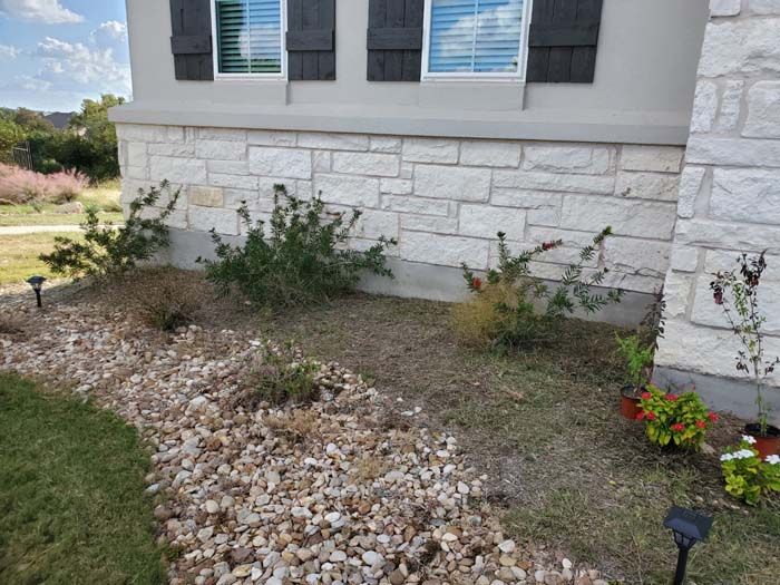 A house with a lot of rocks in front of it.