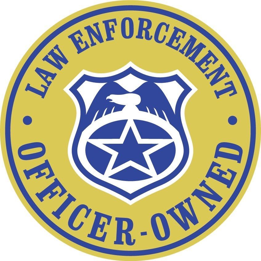 A circular blue and gold emblem featuring a shield with an eagle and a star, with the text 