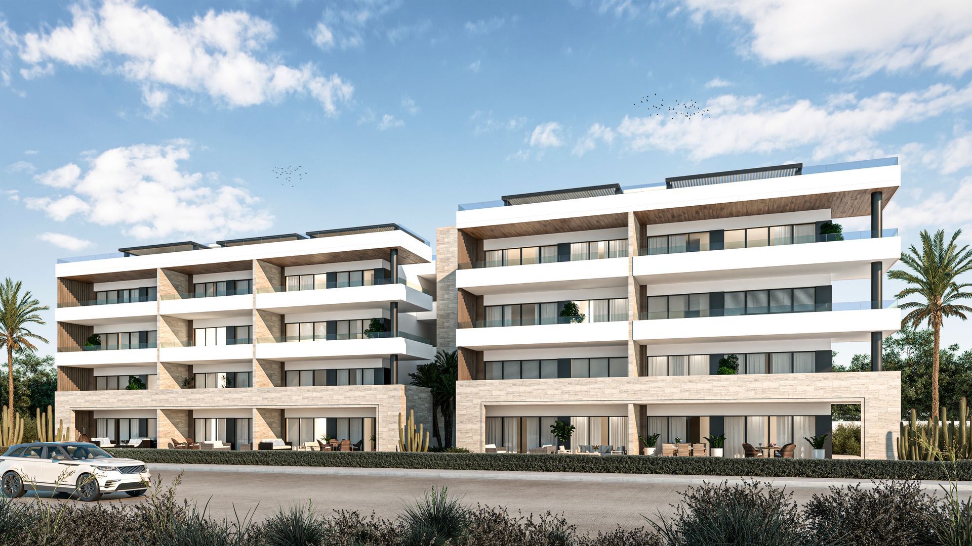 Modern living room with open layout: sofa, dining table, kitchen, wood accents, and natural light.