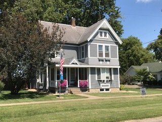 Large House with American Flag — Oglesby, IL — H & S Contracting Inc.