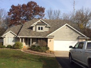 White Truck in Front of Large House — Oglesby, IL — H & S Contracting Inc.