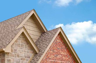 House with Orange Roof — Pulaski Roofers in Baltimore, MD