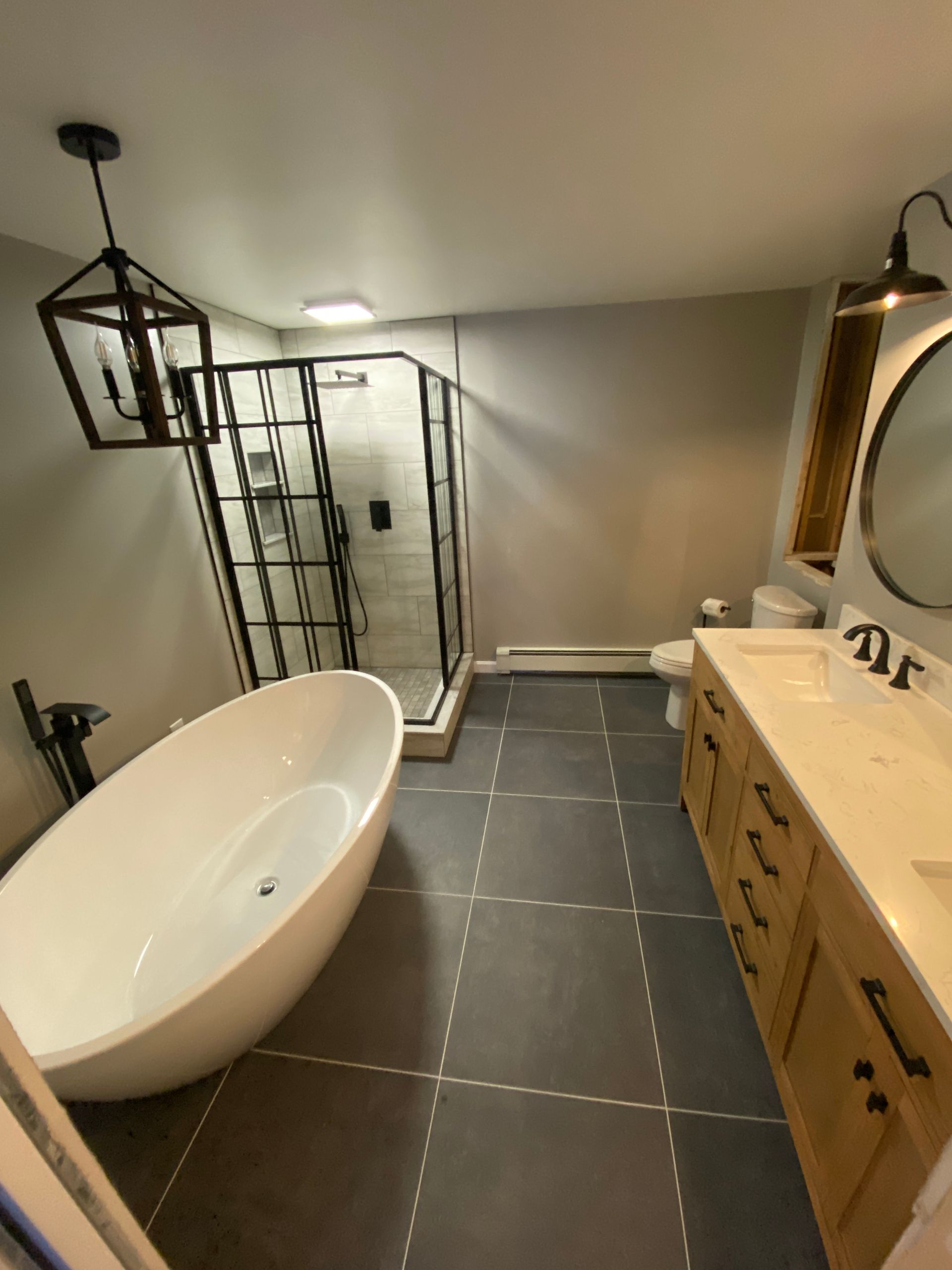 A bathroom with a bathtub and two sinks