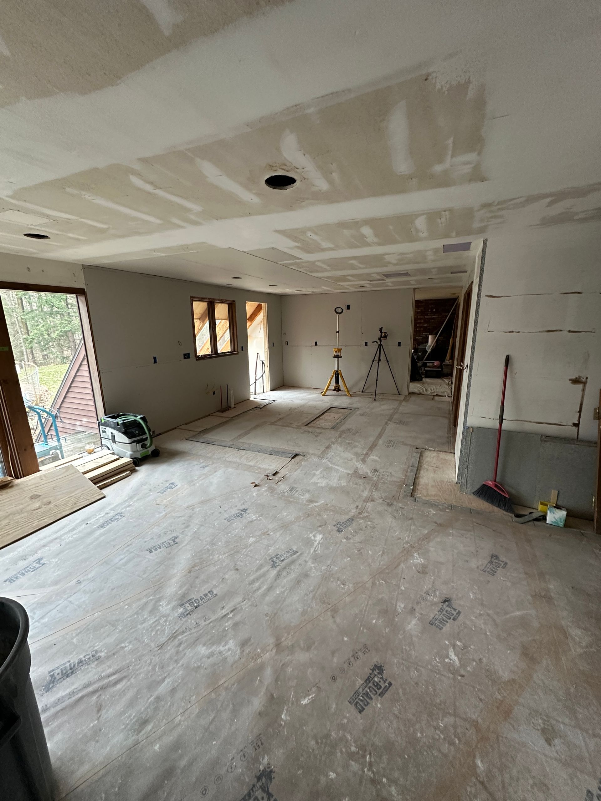 A large room with a ceiling that is being remodeled.