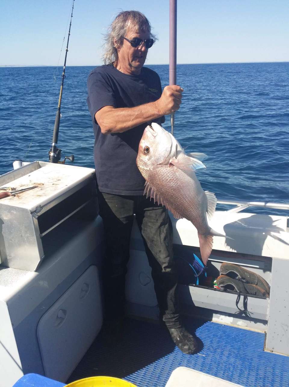 individual unhooking a fish