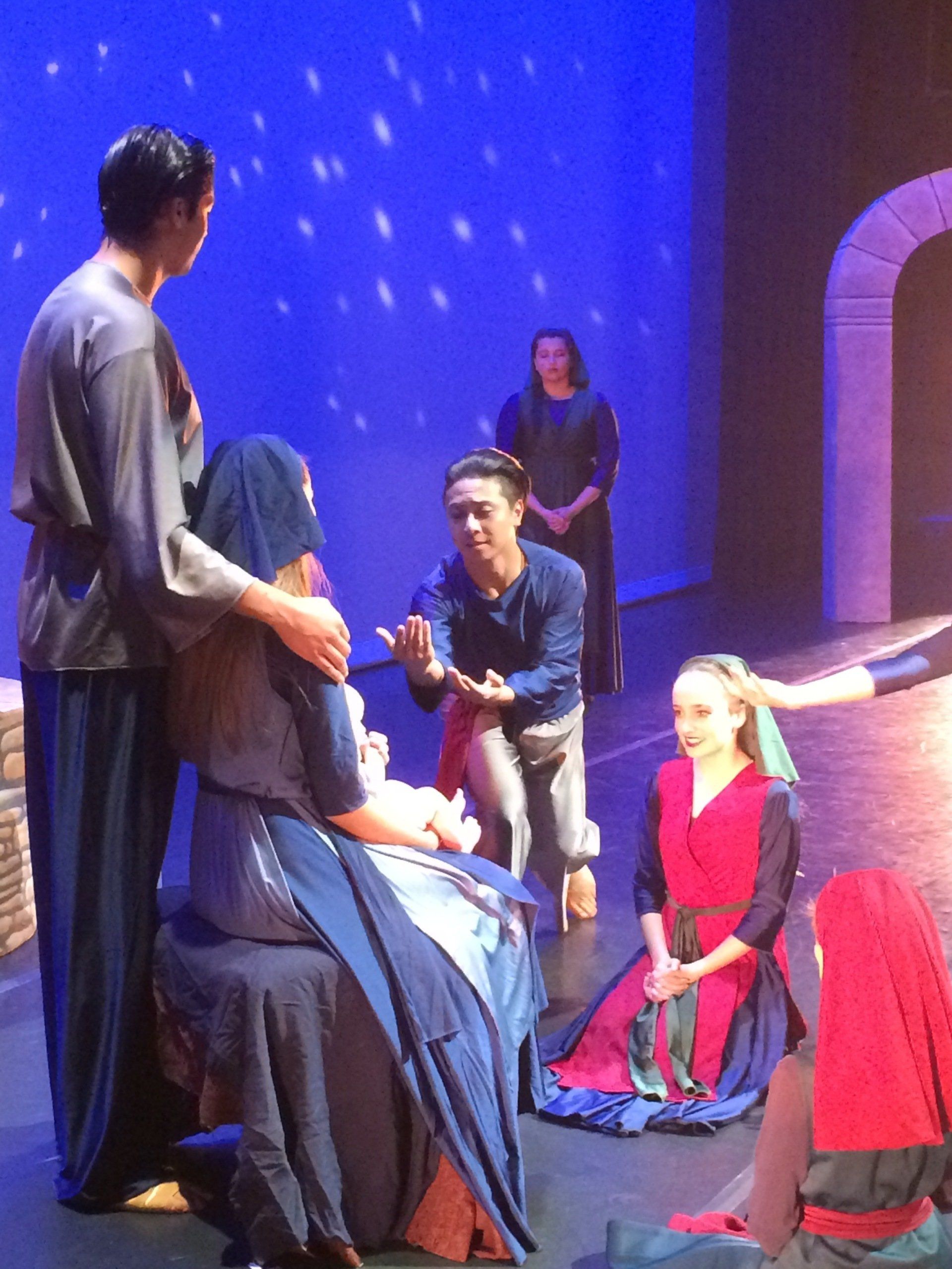 people gather to worship the baby Jesus