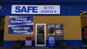 SAFE Auto Service shop front with blue and yellow exterior; offers coolant flush and engine light diagnosis.