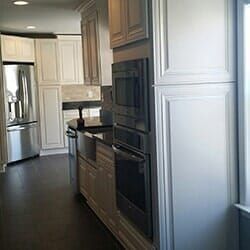 A Kitchen with White Cabinets and Stainless Steel Appliances.