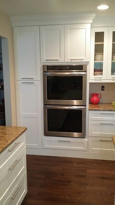 A Kitchen with White Cabinets and Stainless Steel Double Ovens.