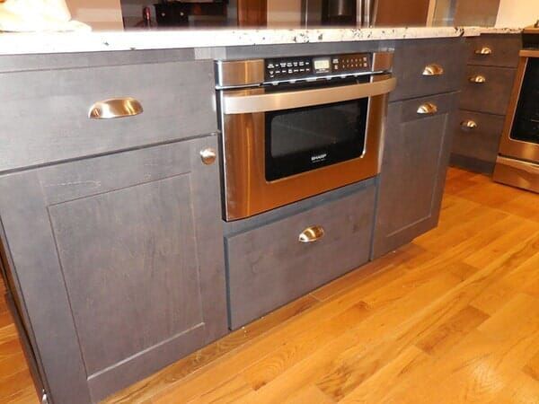 A Kitchen with Stainless Steel Appliances Including a Microwave Oven