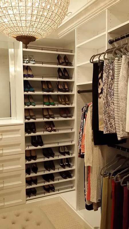 A Walk in Closet Filled with Lots of Shoes and Clothes.