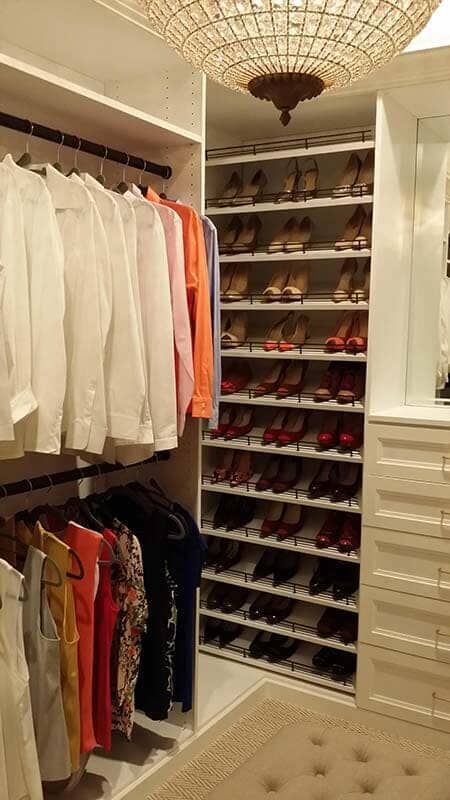 A Walk in Closet Filled with Clothes and Shoes.