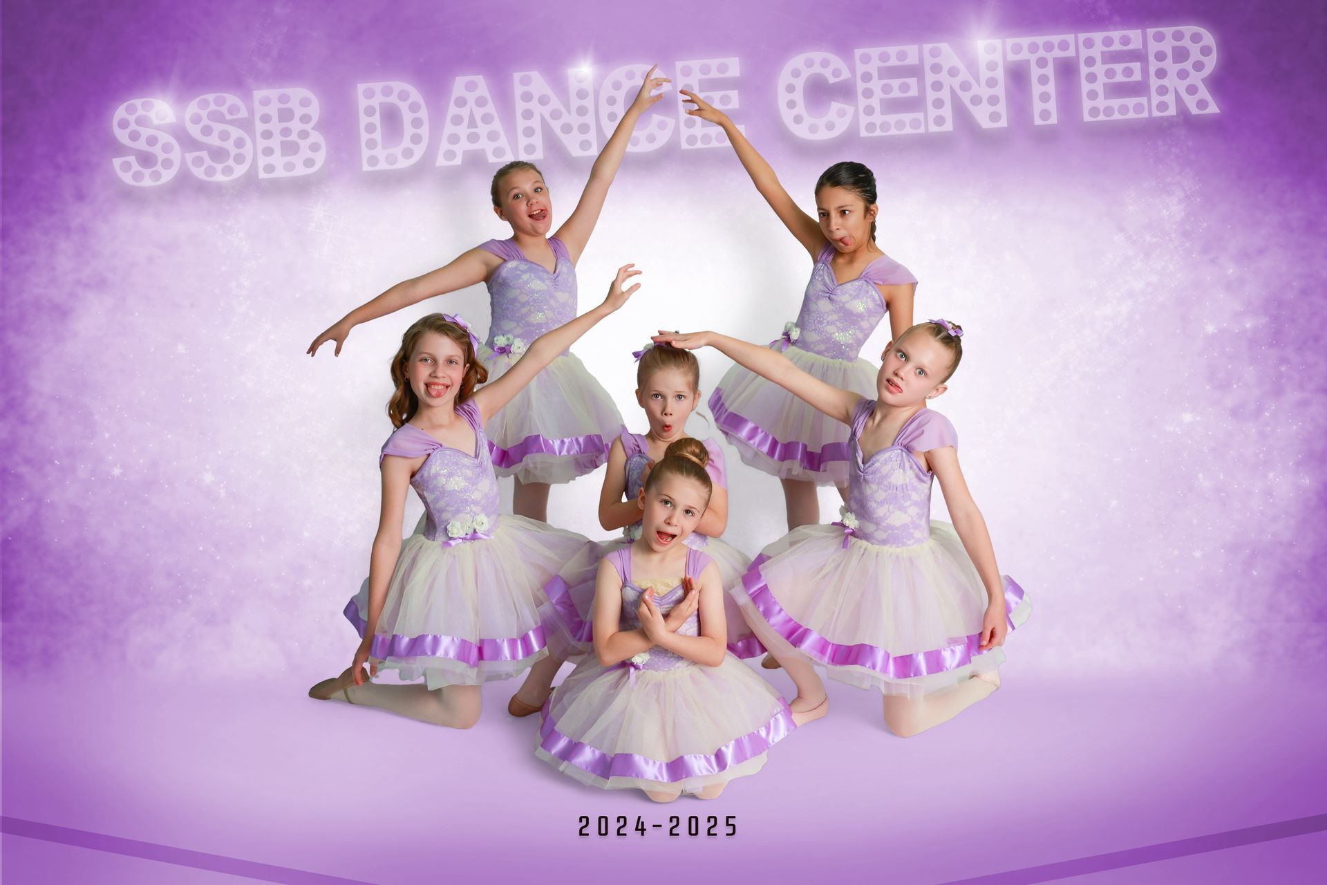 Group of young dancers in lilac dresses, posing, with 
