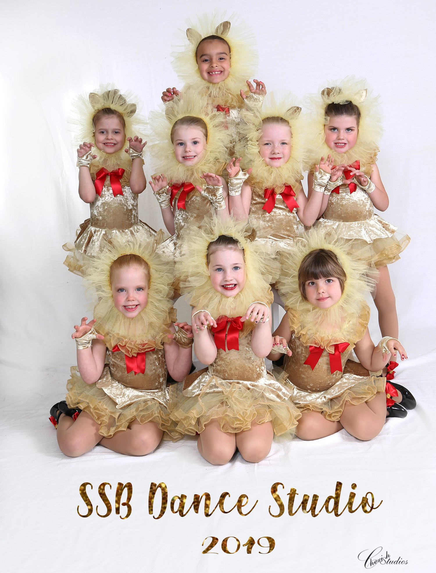 Children in gold lion costumes, posed for SSB Dance Studio 2019 photo.