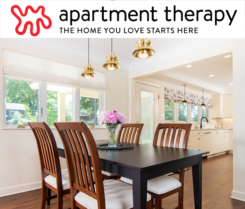 A dining room with a table and chairs and the apartment therapy logo