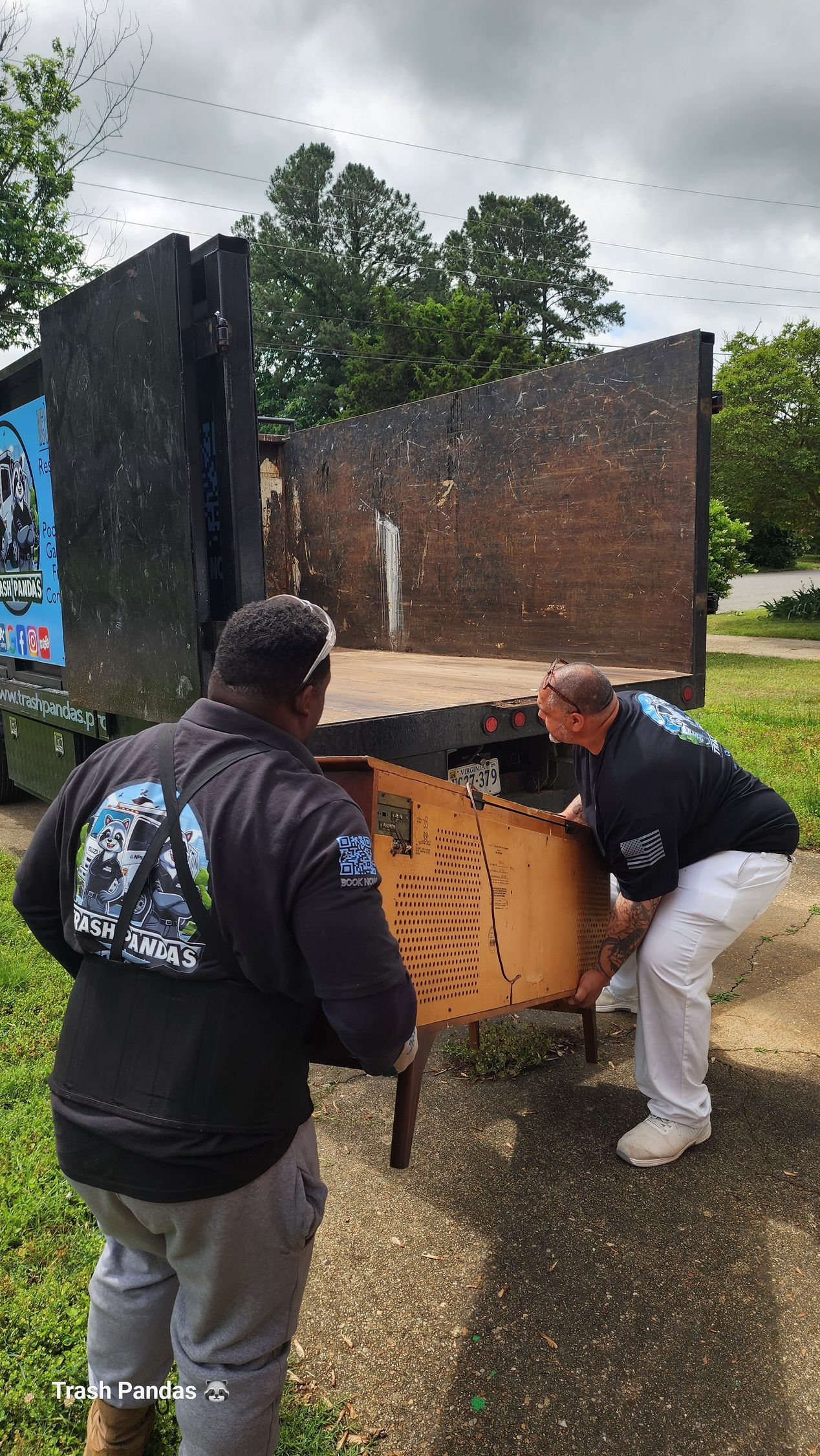 A feather pen is sitting on top of a stack of books
