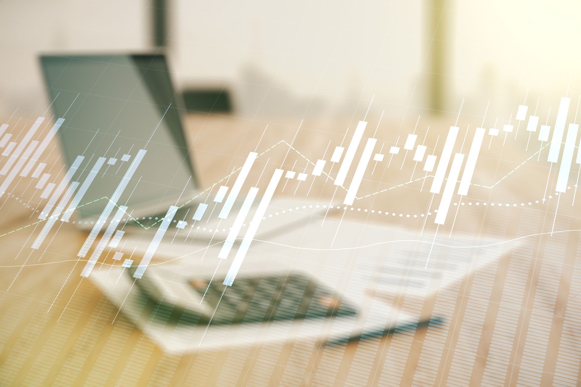 A laptop computer , calculator , pen and papers on a wooden table.