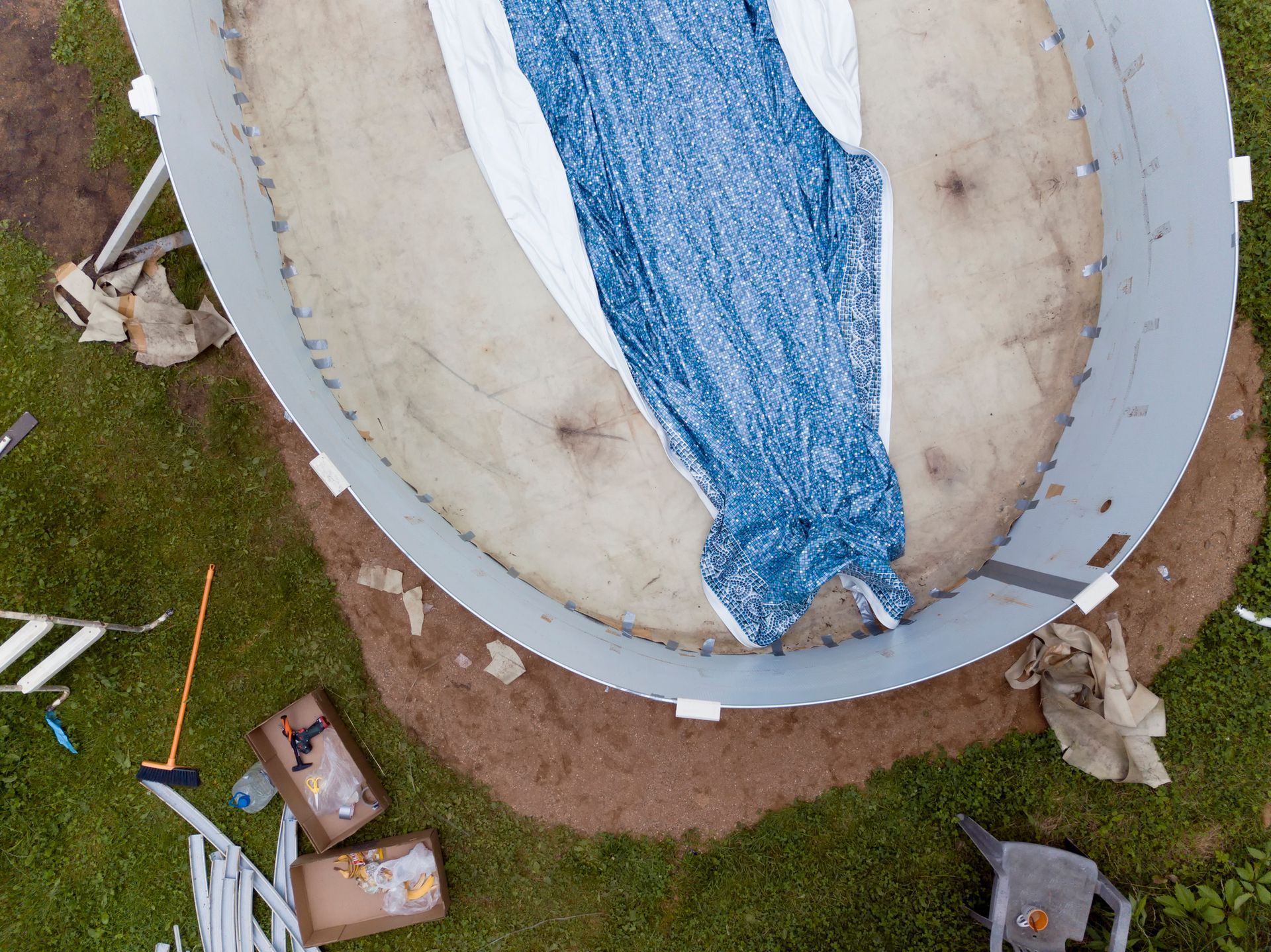 An above-ground pool being removed.