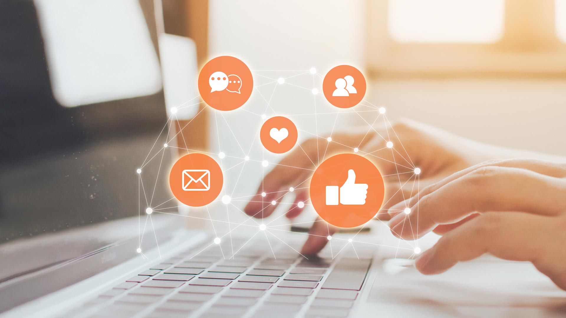 Fingers typing in social media posts on a computer keyboard
