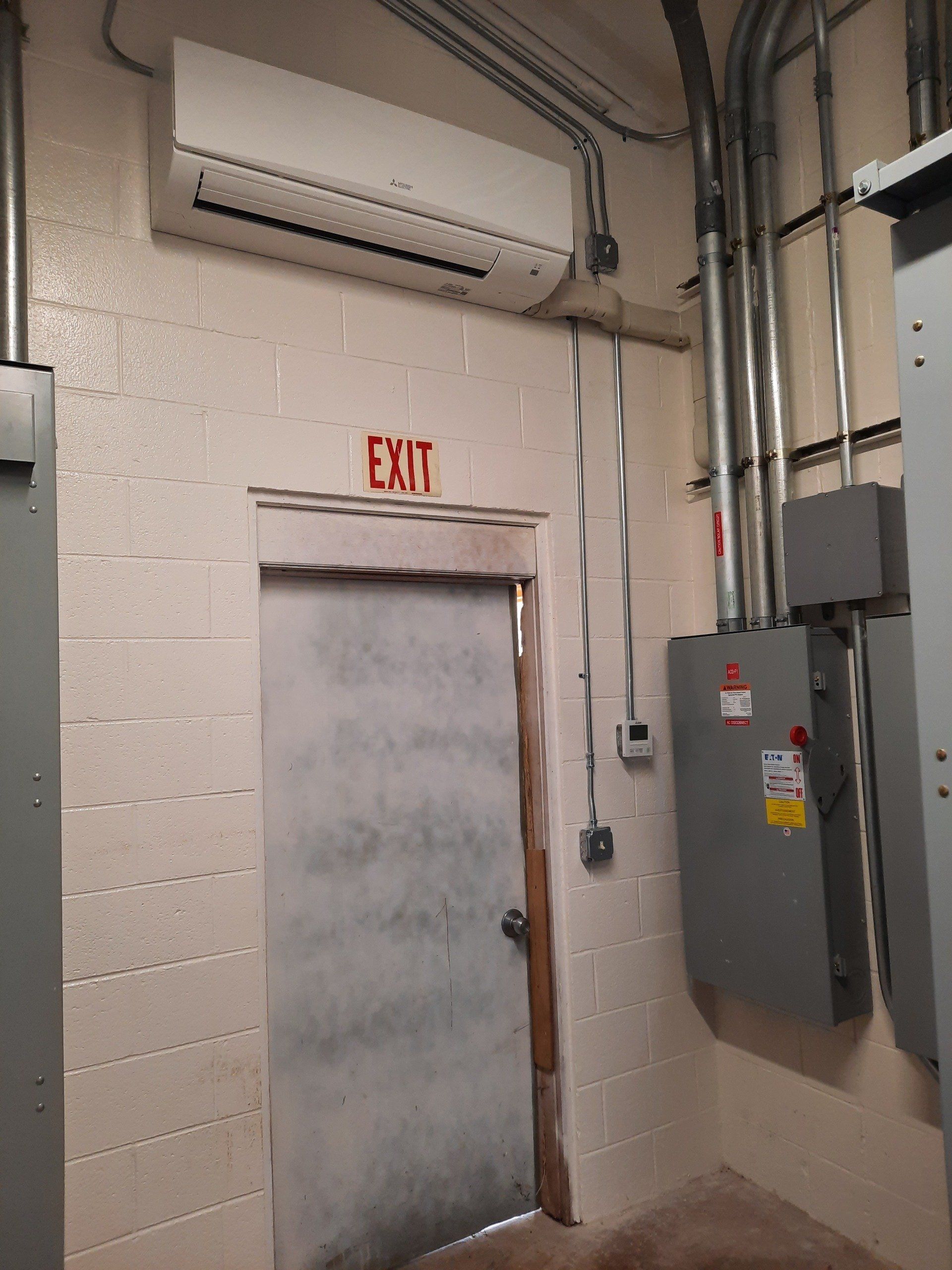 Commercial Heat Pump Above Exit Door