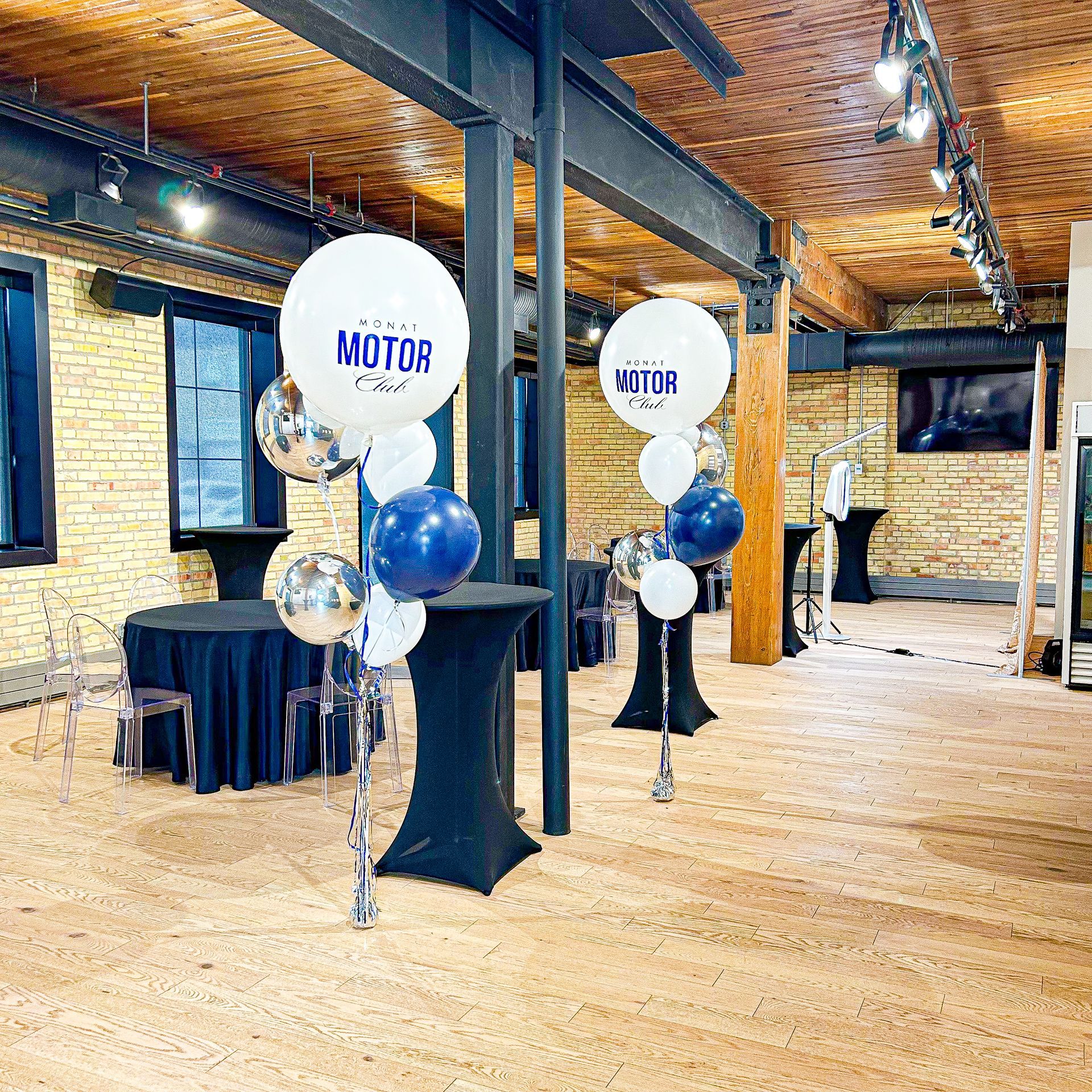 A bunch of balloons with one that says motor on it