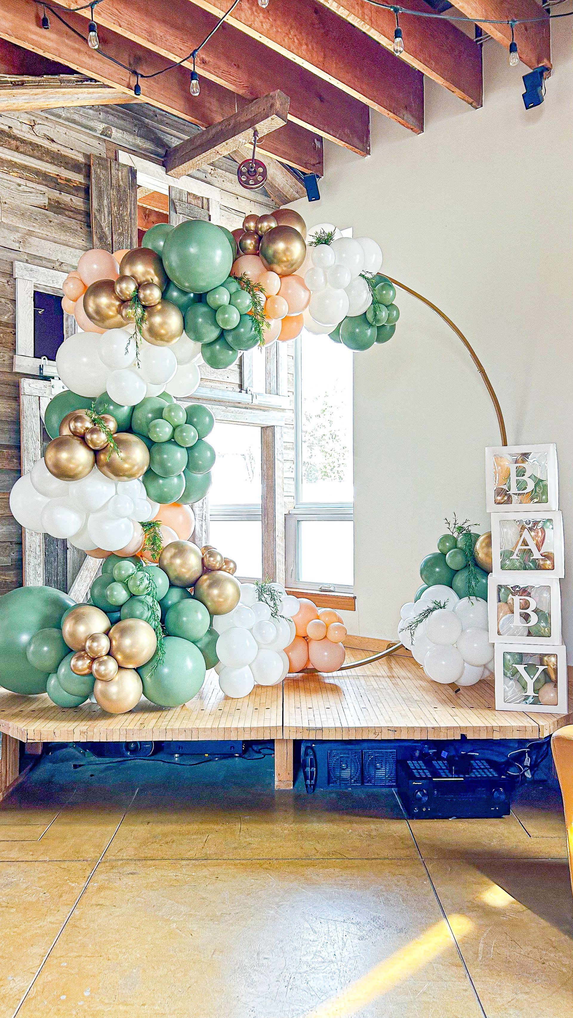 A bunch of balloons are sitting on a table in a room.