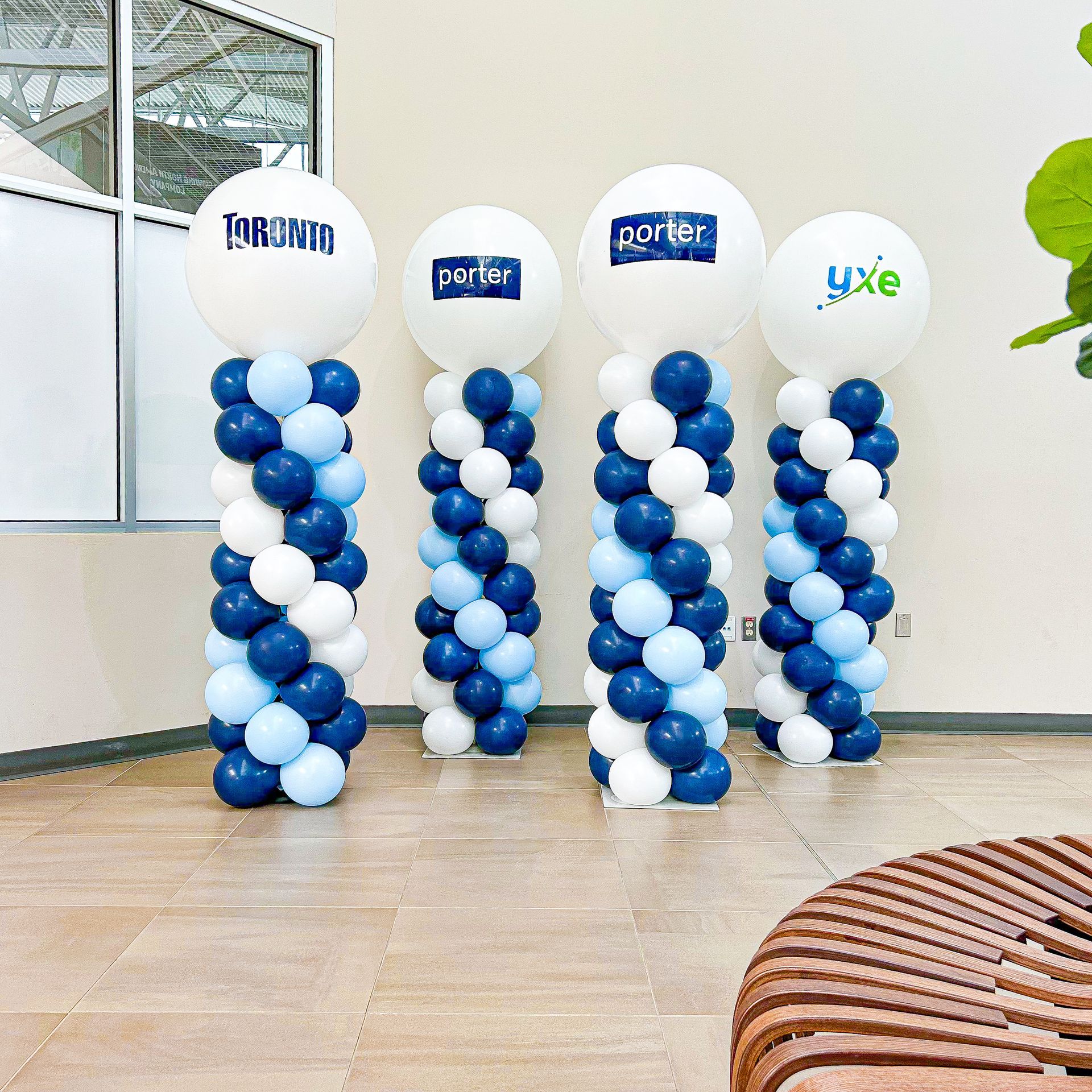 A bunch of blue and white balloons with the word porter on them