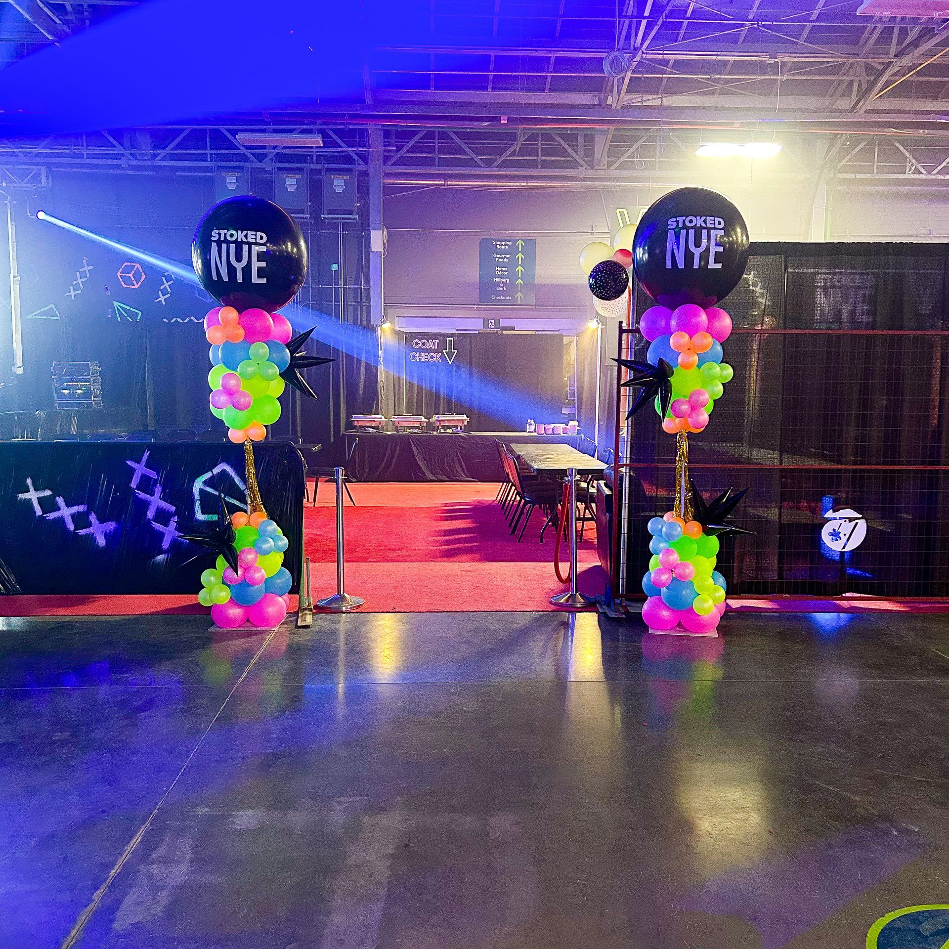 New year 's eve balloons are displayed in a dark room