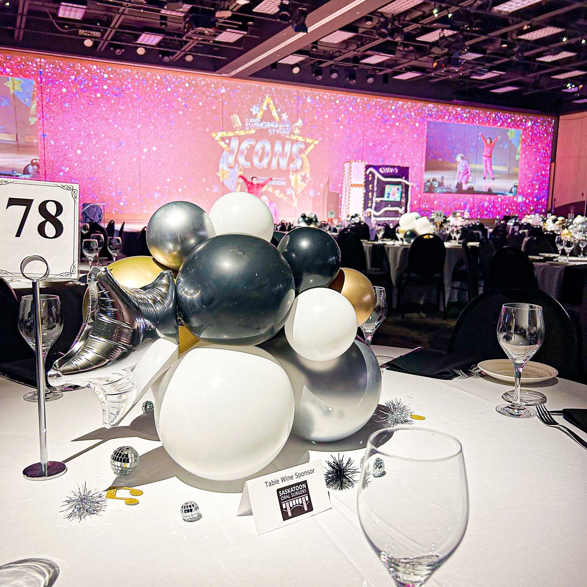 A table with balloons and a sign that says 78