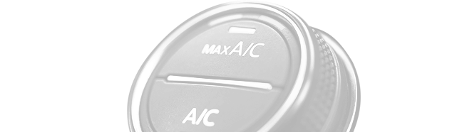 A close-up of a circular car climate control dial featuring buttons for MAX A/C and A/C. | Rapid Auto and Truck Repair