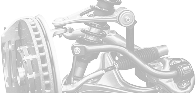 A monochromatic close-up of a vehicle's front suspension system, showing the brake rotor, control arms, and coil spring. | Rapid Auto and Truck Repair