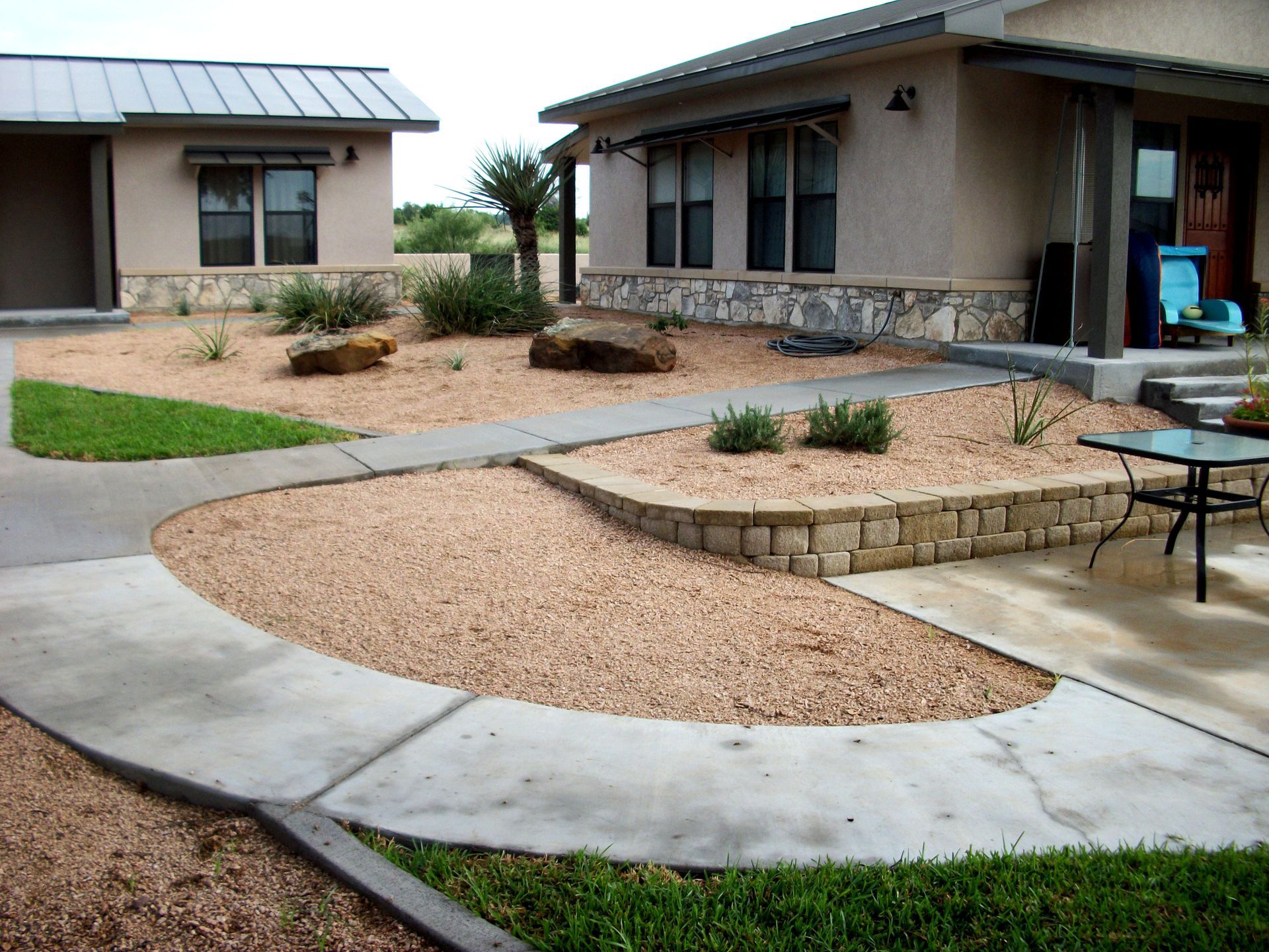 A house with a concrete walkway leading to it