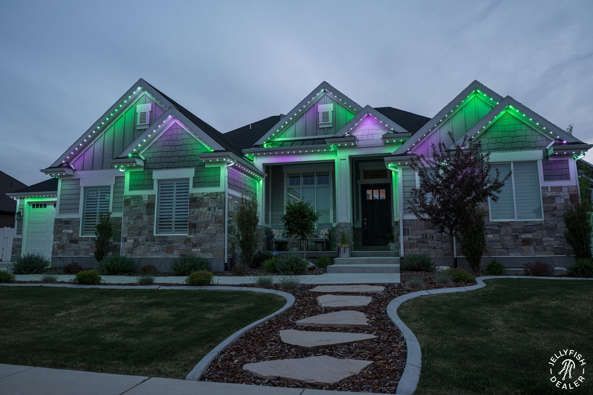 A house with green and purple lights on it