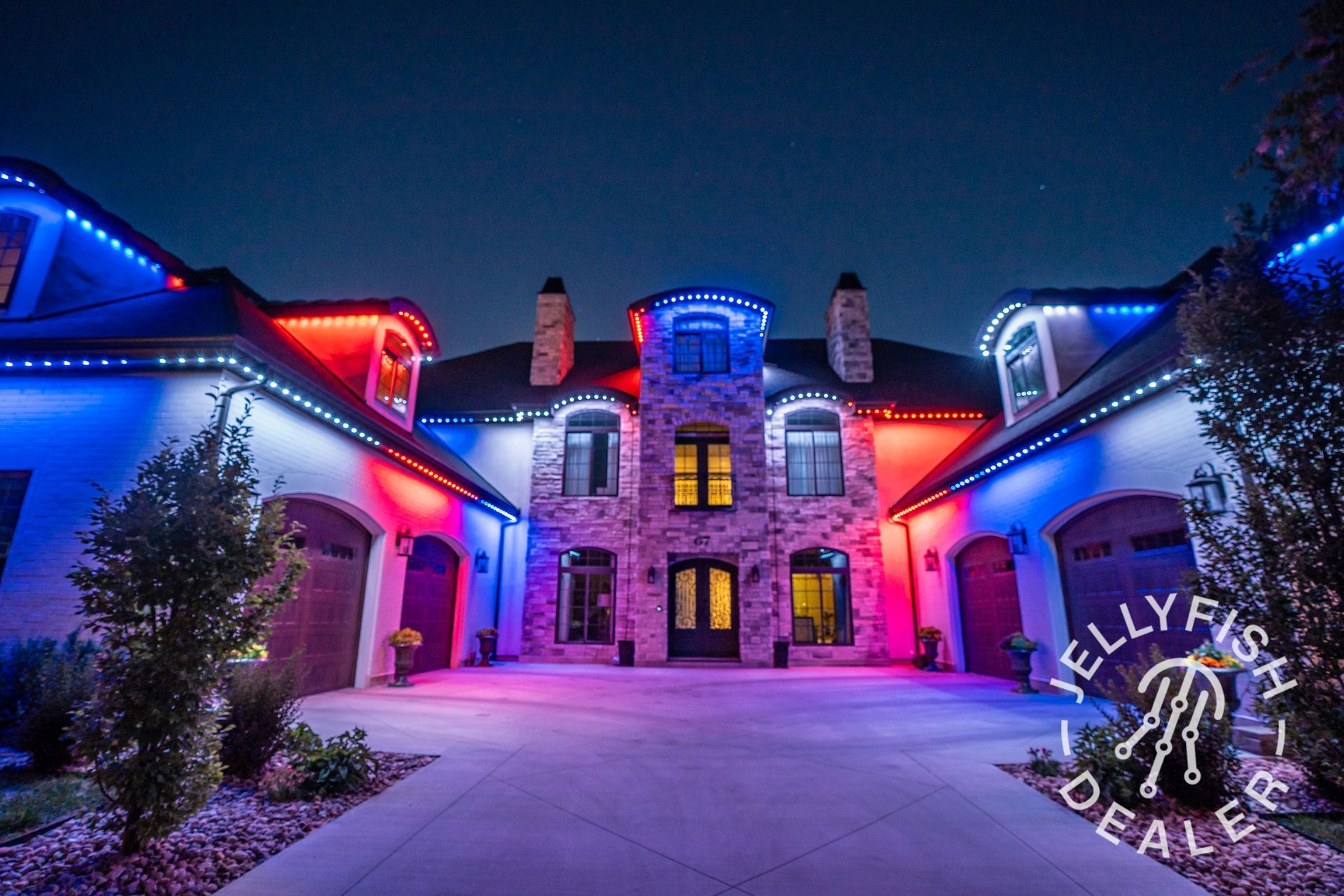 A large house with red white and blue lights on it