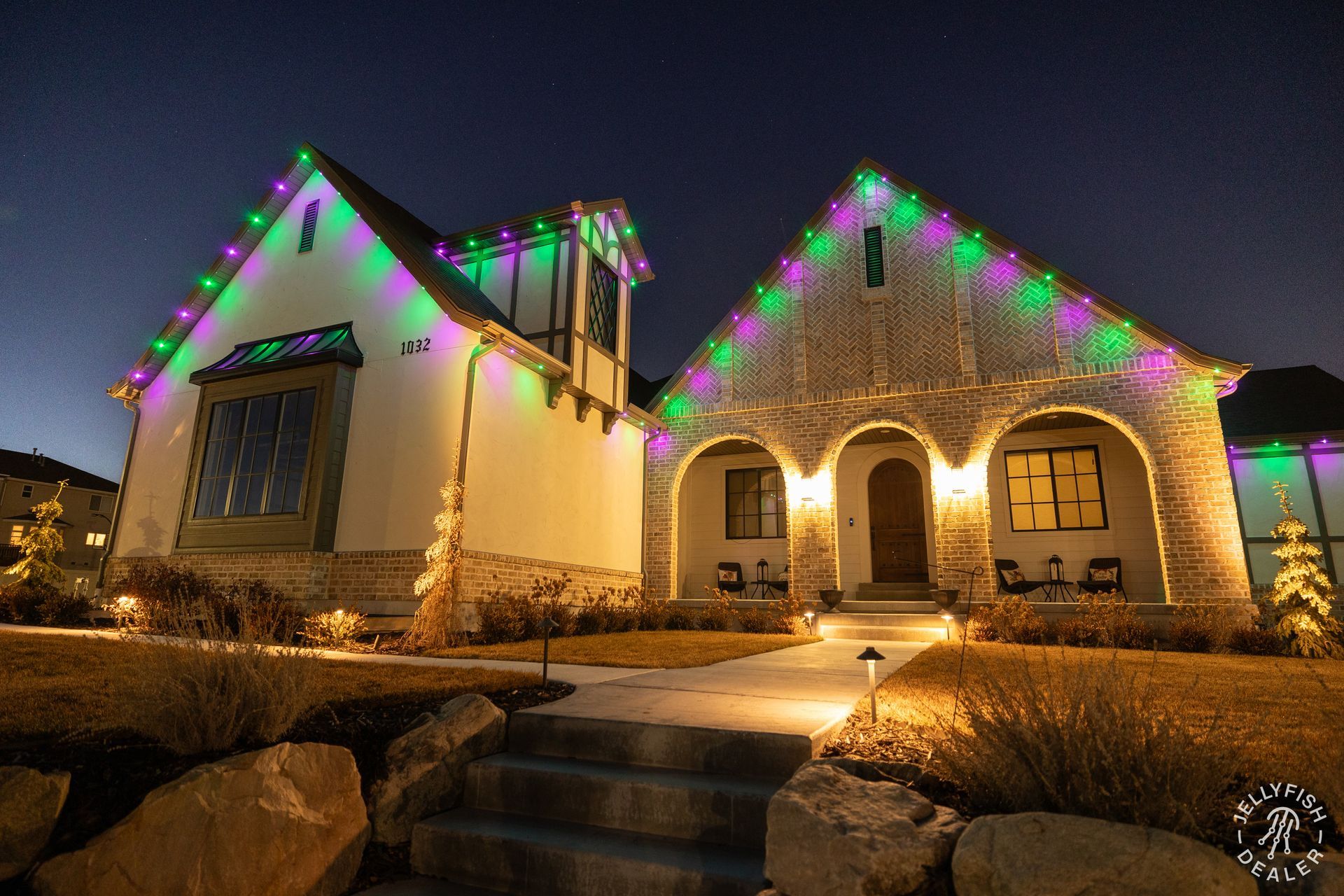 A house with christmas lights on it at night
