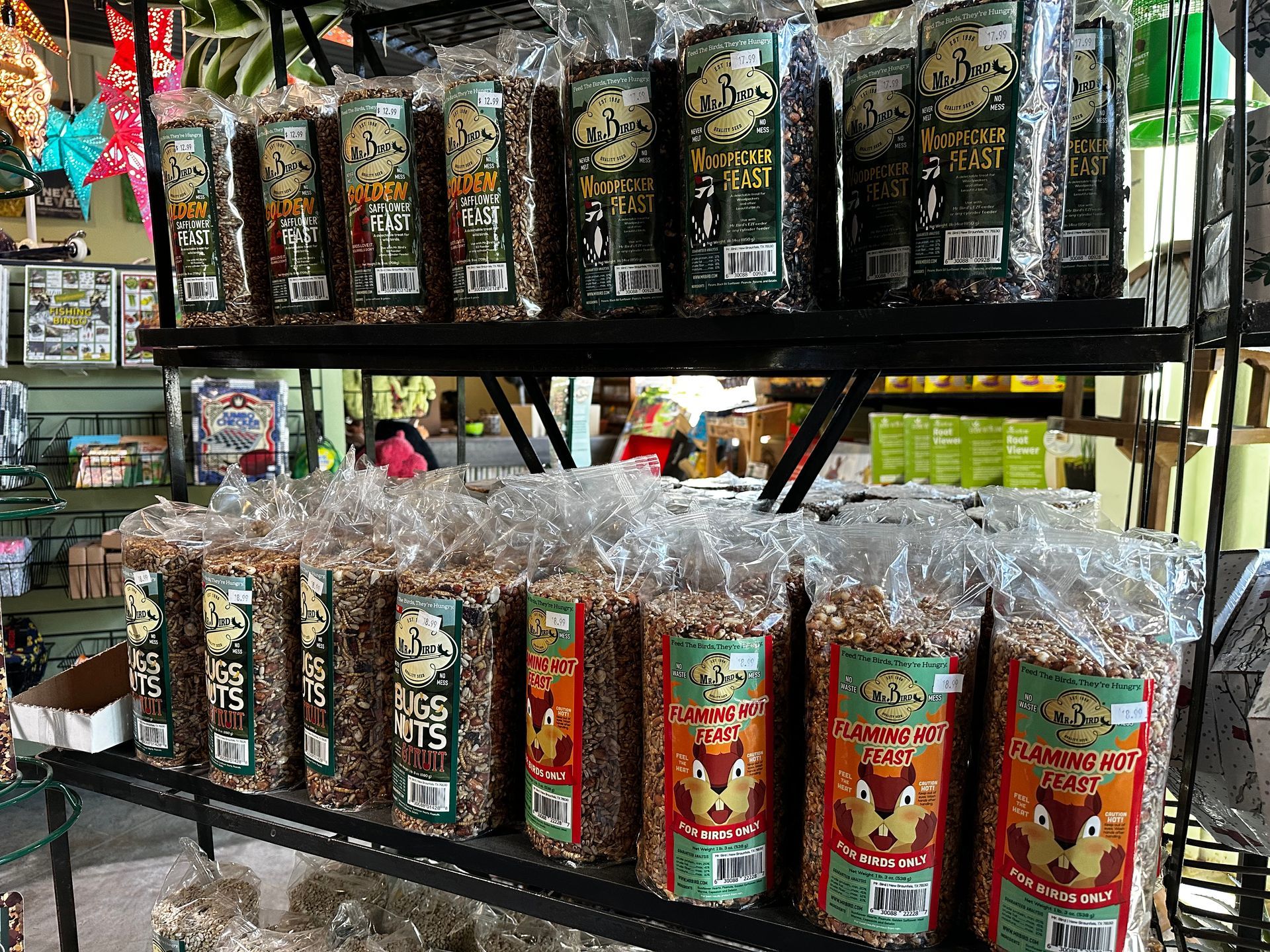 A shelf filled with bags of food in a store.