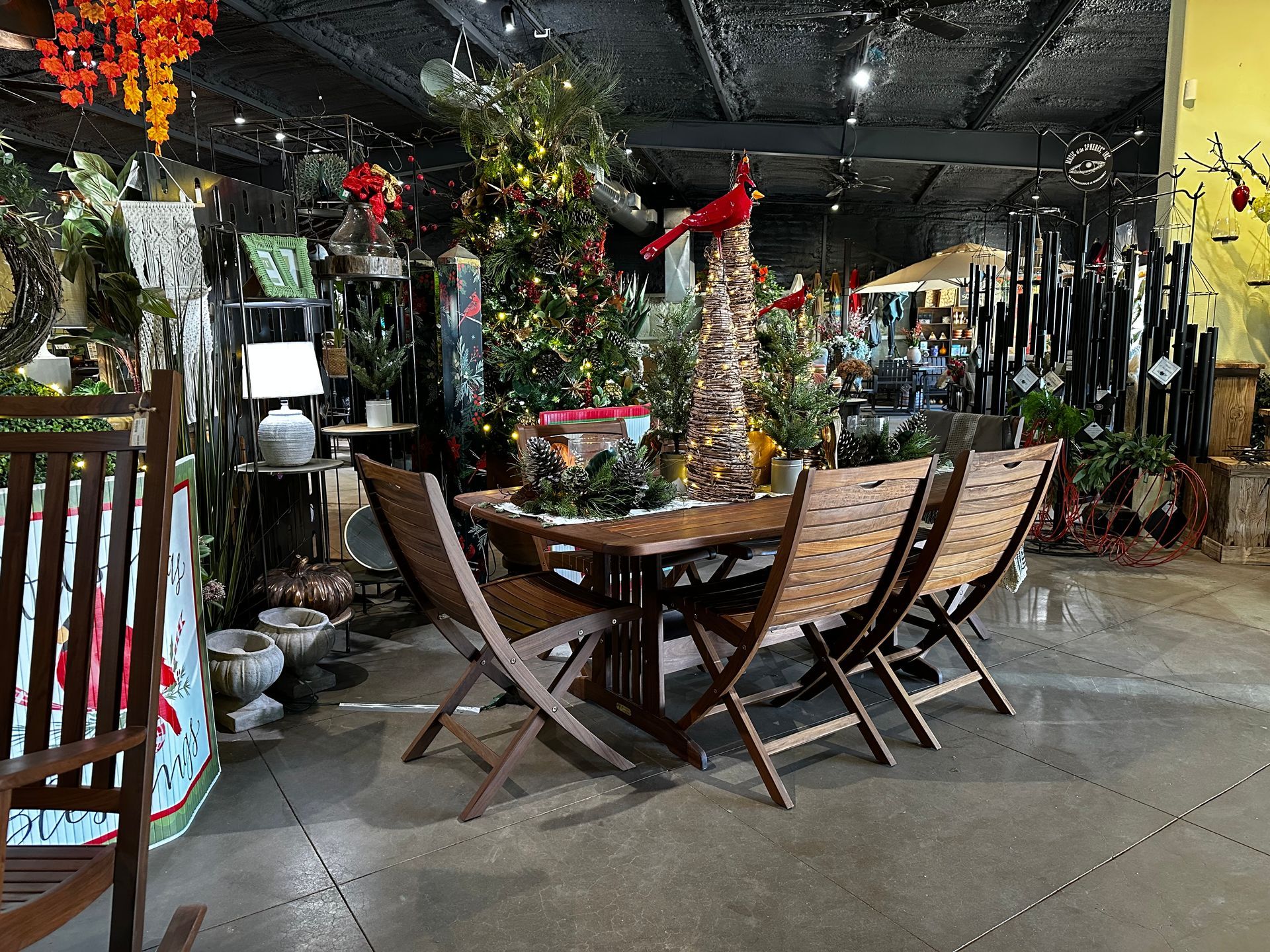 There is a table and chairs in the middle of the room.