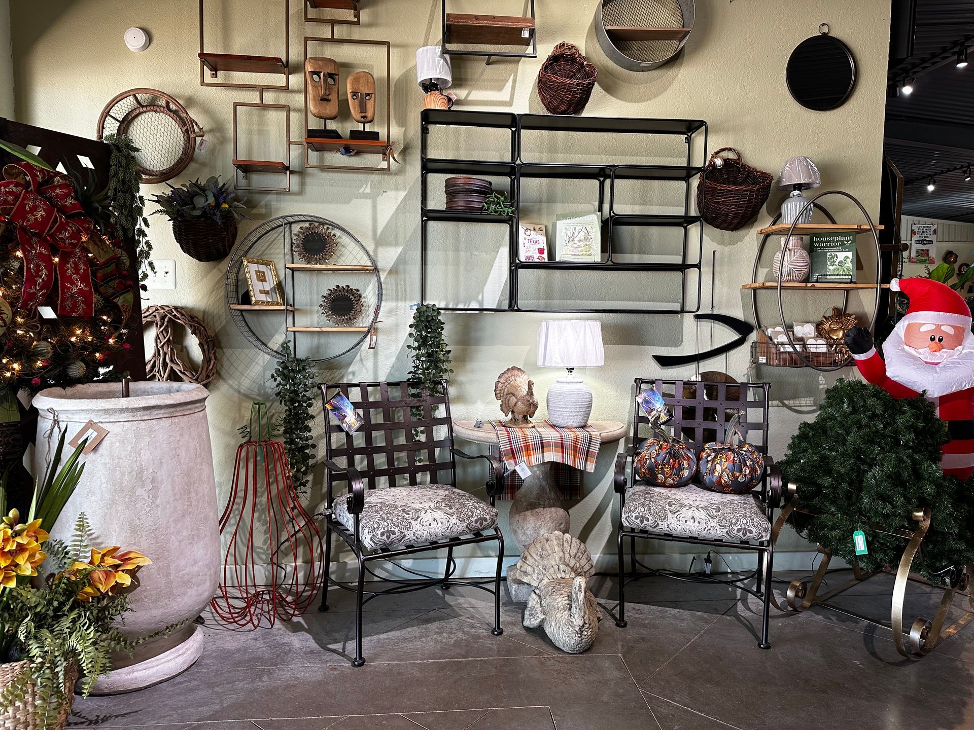 A room with a bench and chairs and a santa claus statue