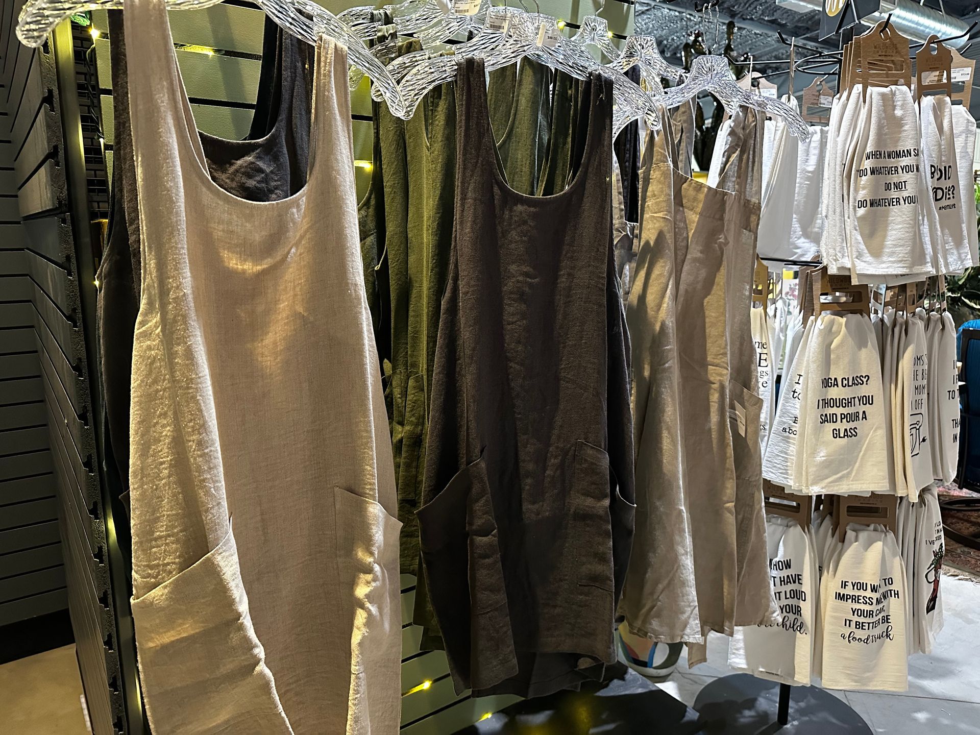 A display of tank tops and aprons in a store