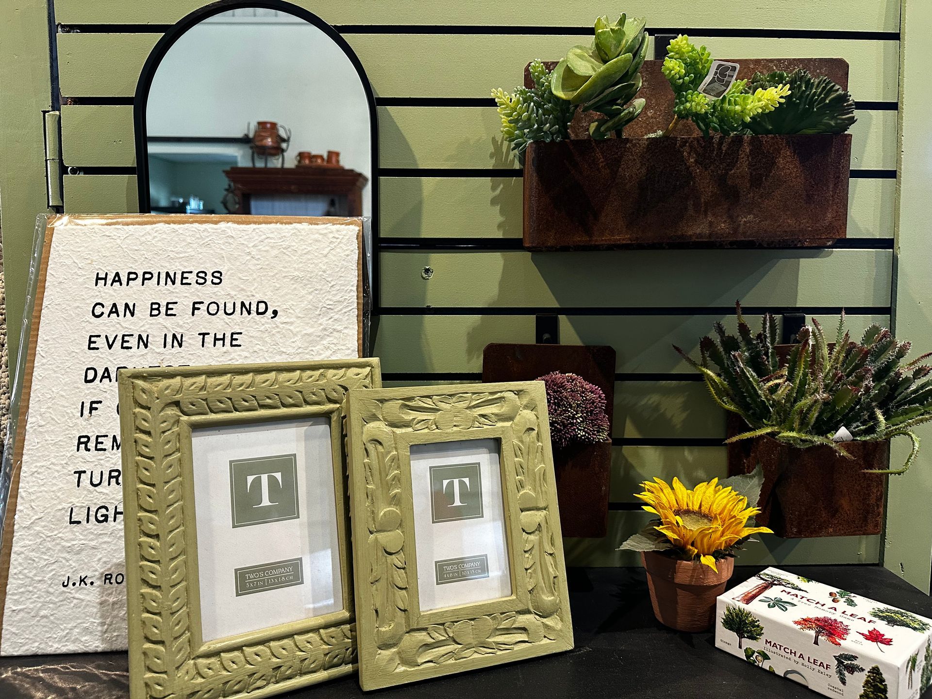 A sign that says happiness can be found even in the dark