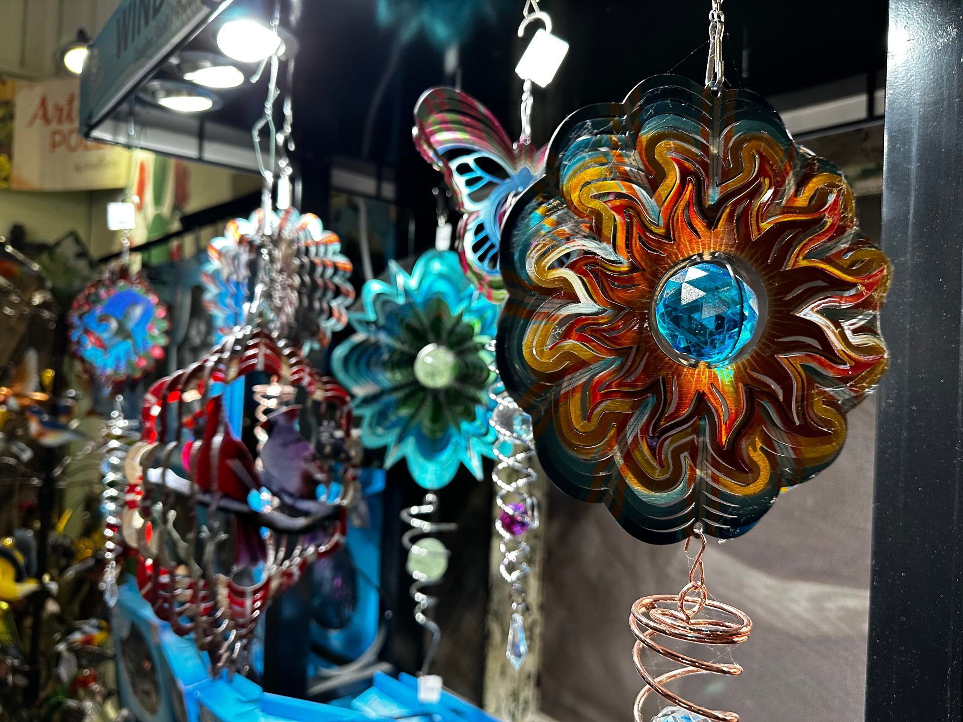 A display of colorful flowers and butterflies in a store