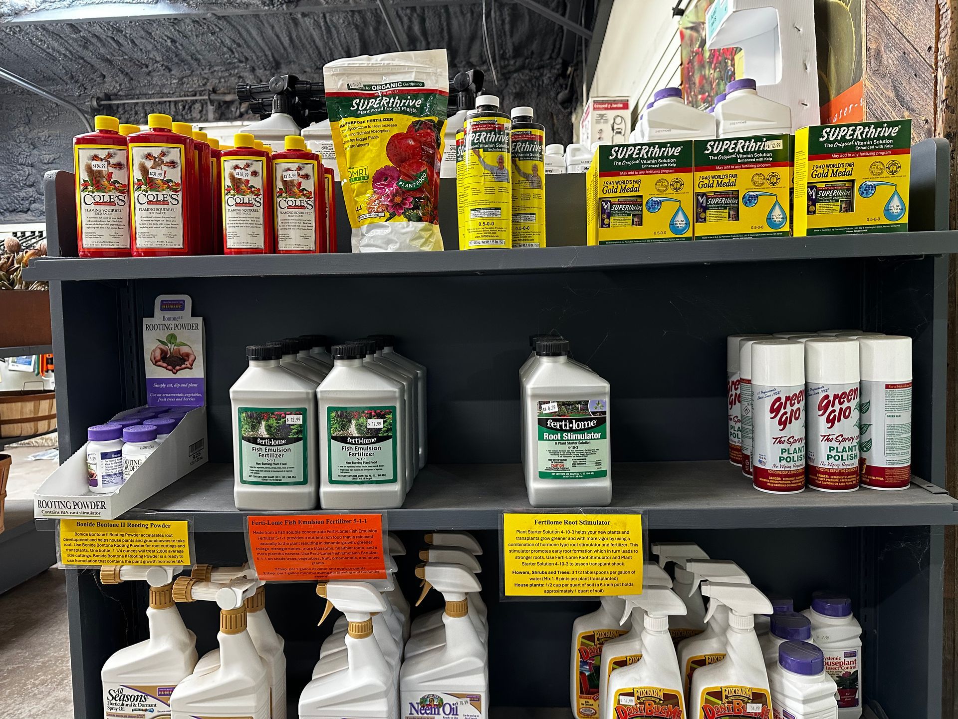 A shelf filled with lots of bottles of cleaning supplies.