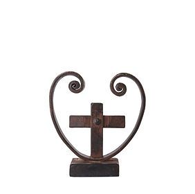 A statue of a cross in the shape of a heart on a white background.