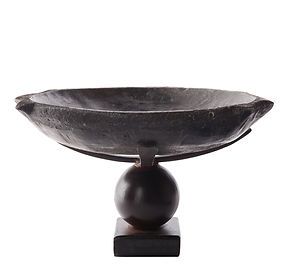 A black bowl on a wooden stand on a white background.