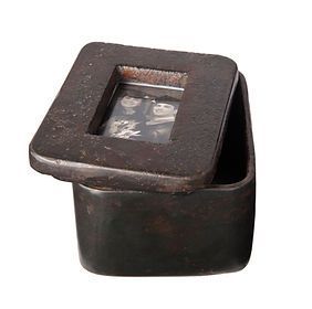 A small black box with a picture inside of it.