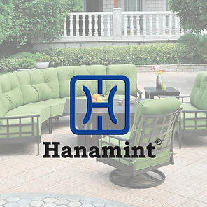 A picture of a hanamint patio set with green cushions