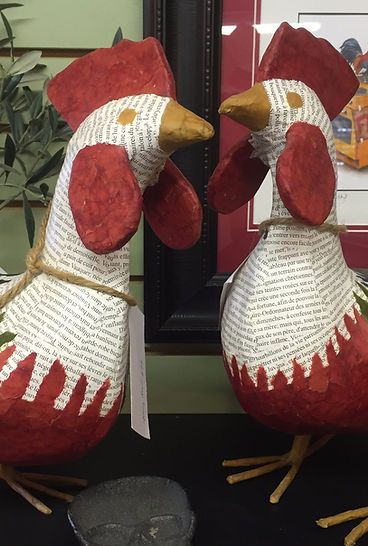 Two stuffed chickens are sitting next to each other on a table