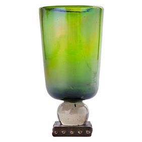 A green glass vase with a wooden base on a white background.