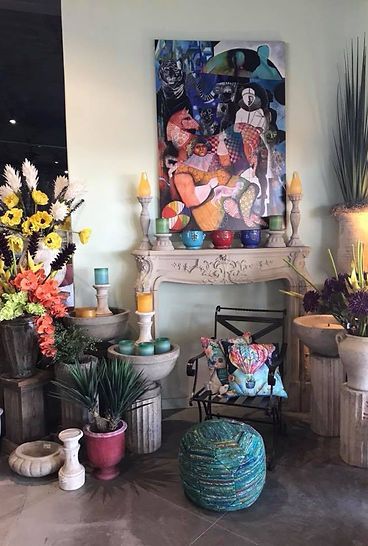 There is a painting on the wall above the fireplace.