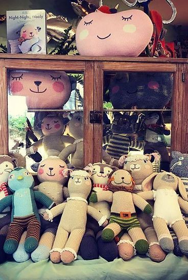 A bunch of stuffed animals are sitting on a table